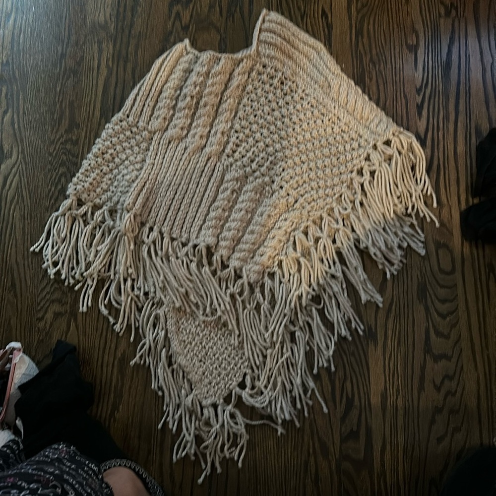 Gorgeous hand knit poncho, small or medium size. Shorter in the front long back